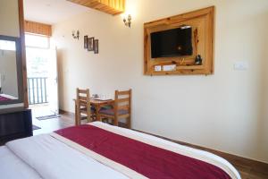 Postel nebo postele na pokoji v ubytování HOTEL DEV CHHAYA