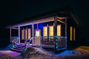 a house with blue lights on the front of it at Nikitskoe Podvorie in Pereslavl-Zalesskiy