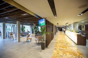 a lobby of a hospital with a waiting area at Panafrica Hotel Boutique & Spa in Bata