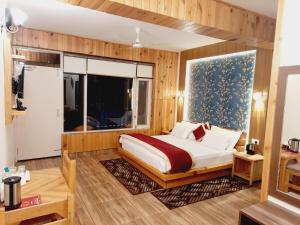 Postel nebo postele na pokoji v ubytování HOTEL DEV CHHAYA