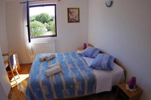 En eller flere senge i et værelse på Apartments Lavinija + 73 billeder