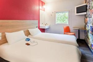 Una cama o camas en una habitación de HOTELF1 Le Havre Est - Gonfreville