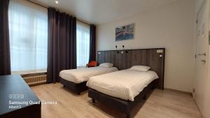 A bed or beds in a room at Albert - Rooms