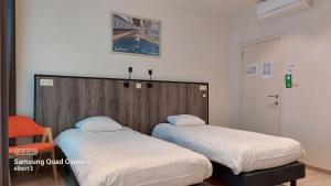 A bed or beds in a room at Albert - Rooms