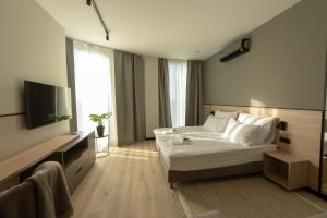 Кровать или кровати в номере Sarnia Point Apartamenty Prestige