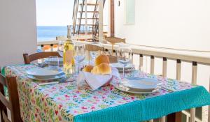 a table with a teddy bear sitting on top at Lungomare Bay, e sei in spiaggia... in Cala Gonone +14 photos