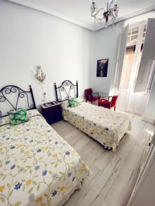 Postel nebo postele na pokoji v ubytování Pensión Antonio Guesthouse