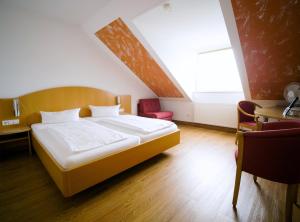 Postel nebo postele na pokoji v ubytování Hotel SunParc - SHUTTLE zum Europa-Park Rust 4km & Rulantica 2km