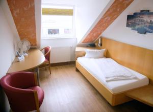 Postel nebo postele na pokoji v ubytování Hotel SunParc - SHUTTLE zum Europa-Park Rust 4km & Rulantica 2km