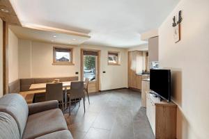 TV a/nebo společenská místnost v ubytování Rasia Residence Relax Mountain
