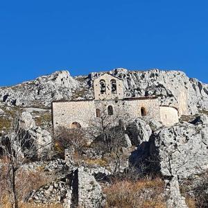 an old building on the side of a mountain at Studio avec cheminée et jardin in Gréolières +25 photos