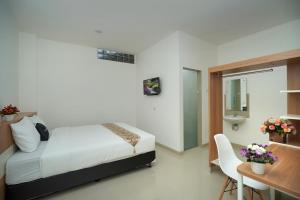 Katil atau katil-katil dalam bilik di Ngampilan Residence Yogyakarta Mitra RedDoorz