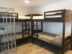 a group of bunk beds in a room at Colonial Hostel in São Paulo