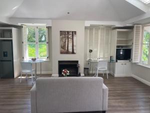 a living room with a couch and a kitchen at Atholanda in Johannesburg