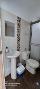 a bathroom with a sink and a toilet at Apartamento la Isla 1-Coveñas in Coveñas