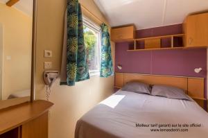 Postel nebo postele na pokoji v ubytování Camping le Mas de Riri