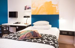 A bed or beds in a room at Original Sokos Hotel Vaakuna Pori