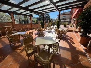Reštaurácia alebo iné gastronomické zariadenie v ubytovaní Hotel Sierra de Ubrique