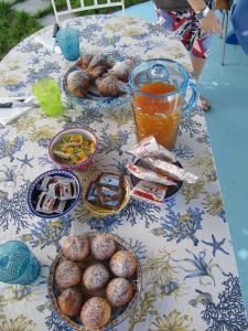 a table with plates of food and drinks on it at Relais Bijoux Ischia in Ischia