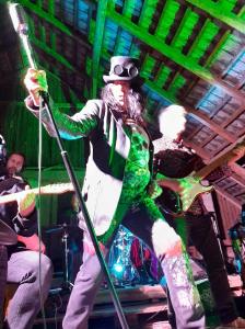a man in a hat playing a guitar on a stage at Kawalerski, Impreza, Wesele in Miechowice Wielkie