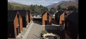 an aerial view of a village with houses at El Coiron Aparts in Esquel