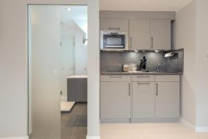 Kuchyň nebo kuchyňský kout v ubytování Studioapartment - Tom