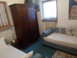 Postel nebo postele na pokoji v ubytování Siusi Sciliar Apartment