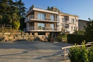 a large apartment building with a stone wall at Dame di Toscana in Lastra a Signa