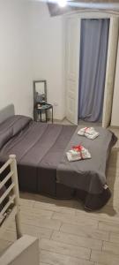 A bed or beds in a room at le ginestre in centro