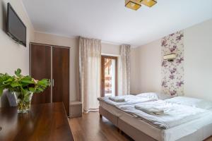 Posteľ alebo postele v izbe v ubytovaní Eskapada