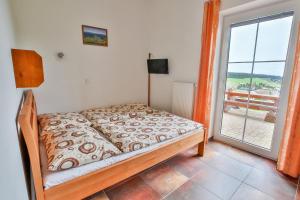 Postel nebo postele na pokoji v ubytování Aparthotel Teddy Kvilda