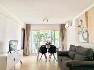 a living room with a couch and a table at Apartamentos Zaragoza in Salou