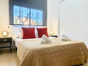 A bed or beds in a room at Apartamentos Zaragoza