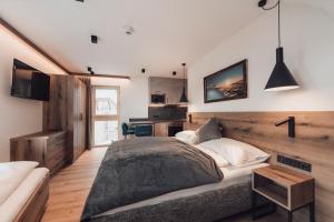 A television and/or entertainment centre at Alpenheim Apartment Ischgl