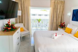 A bed or beds in a room at The SoCo House - All-Inclusive