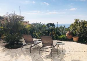 two chairs and a table on a patio at Calanque in Cassis