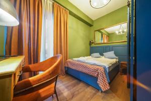 Katil atau katil-katil dalam bilik di Raimond Palace Hotel