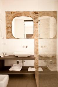 a bathroom with a sink and a mirror at Cinque Terre Coast to Coast in Riomaggiore