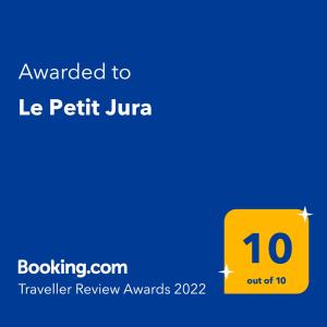 Ett certifikat, pris eller annat dokument som visas upp på Chalet Le Petit Jura