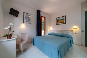 Postel nebo postele na pokoji v ubytování Hotel Valle Verde