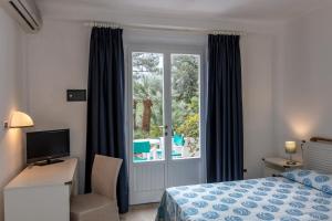Postel nebo postele na pokoji v ubytování Hotel Valle Verde
