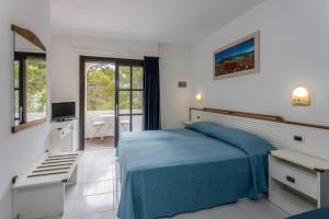 Postel nebo postele na pokoji v ubytování Hotel Valle Verde