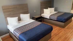 Postel nebo postele na pokoji v ubytování Palace Inn - Baytown I-10