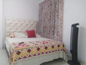 Voodi või voodid majutusasutuse Apartamento oasis del norte toas