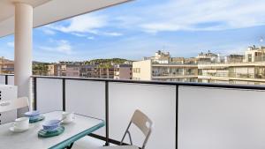 a table and chairs on a balcony with a view at 2Kis - Lloret de Mar in Lloret de Mar