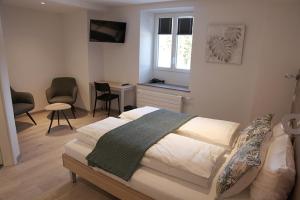 Voodi või voodid majutusasutuse Auberge du Prévoux toas