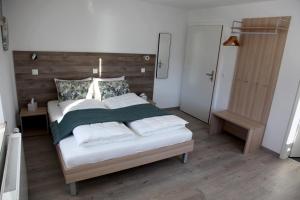 Voodi või voodid majutusasutuse Auberge du Prévoux toas