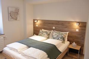 Voodi või voodid majutusasutuse Auberge du Prévoux toas