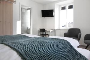 Voodi või voodid majutusasutuse Auberge du Prévoux toas