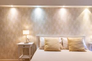 A bed or beds in a room at Studio Apartments Boutique Al Bastione di Cagliari